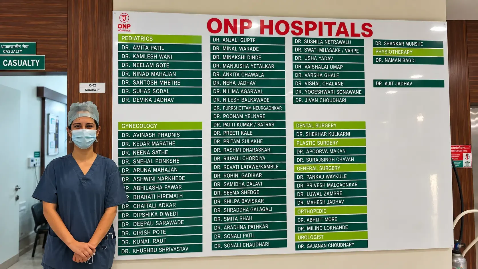 Dr. Apoorva Makan standing in front of name board ONP Hospital, Pimple Saudagar.