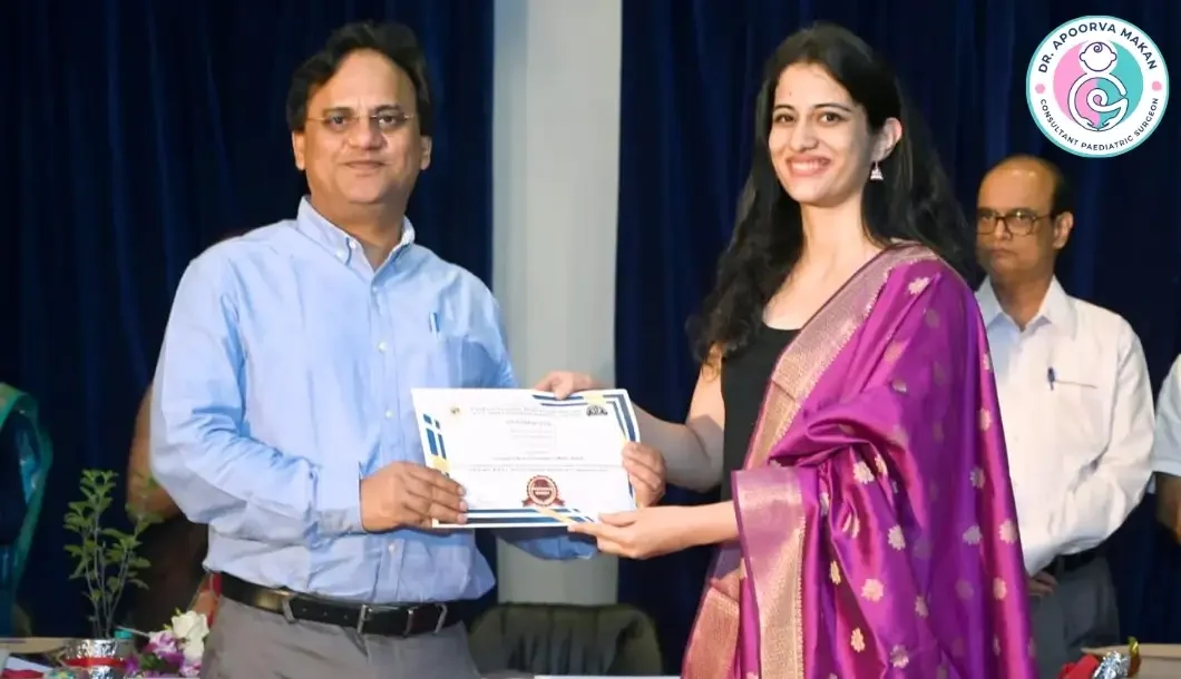 Dr. Apoorva Makan receiving appreciation letter from dignitaries in Pune.
