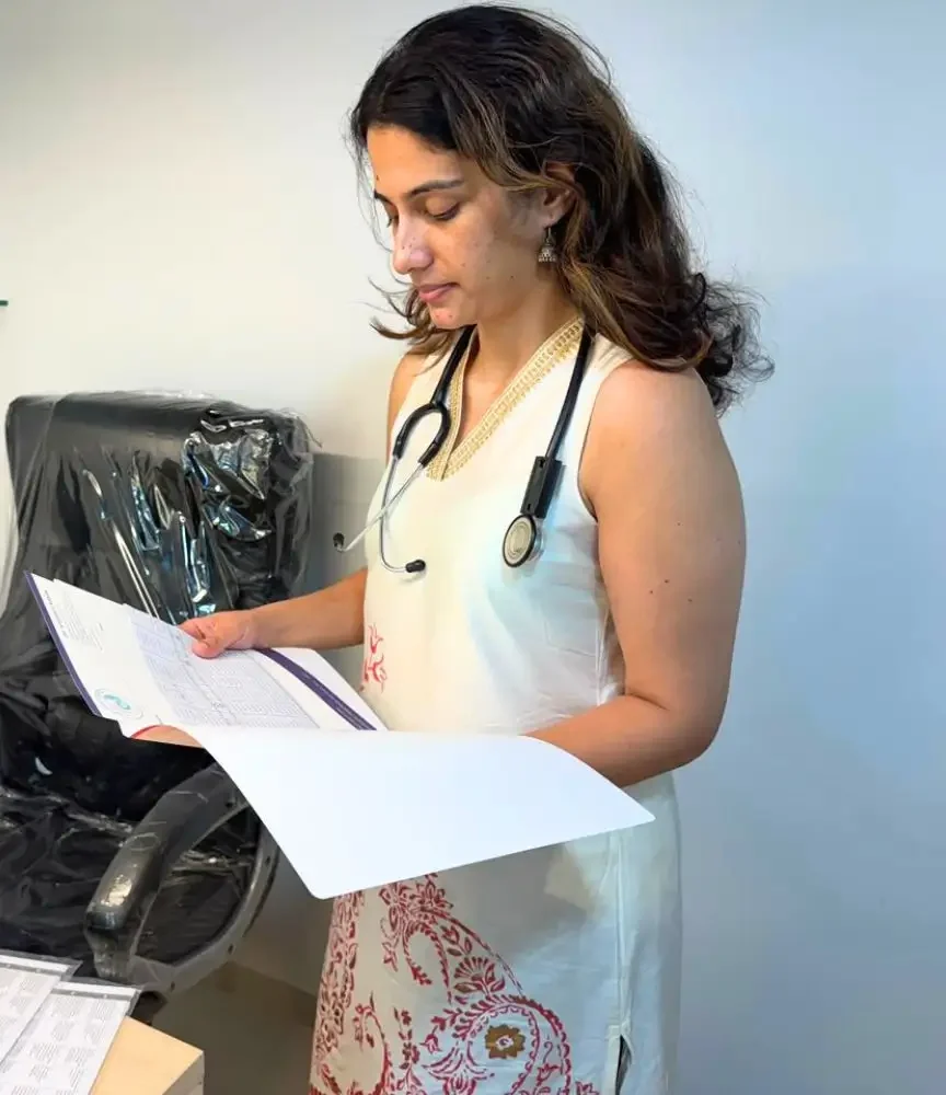 Dr. Apoorva Makan reading surgery file of Orchidopexy patient.