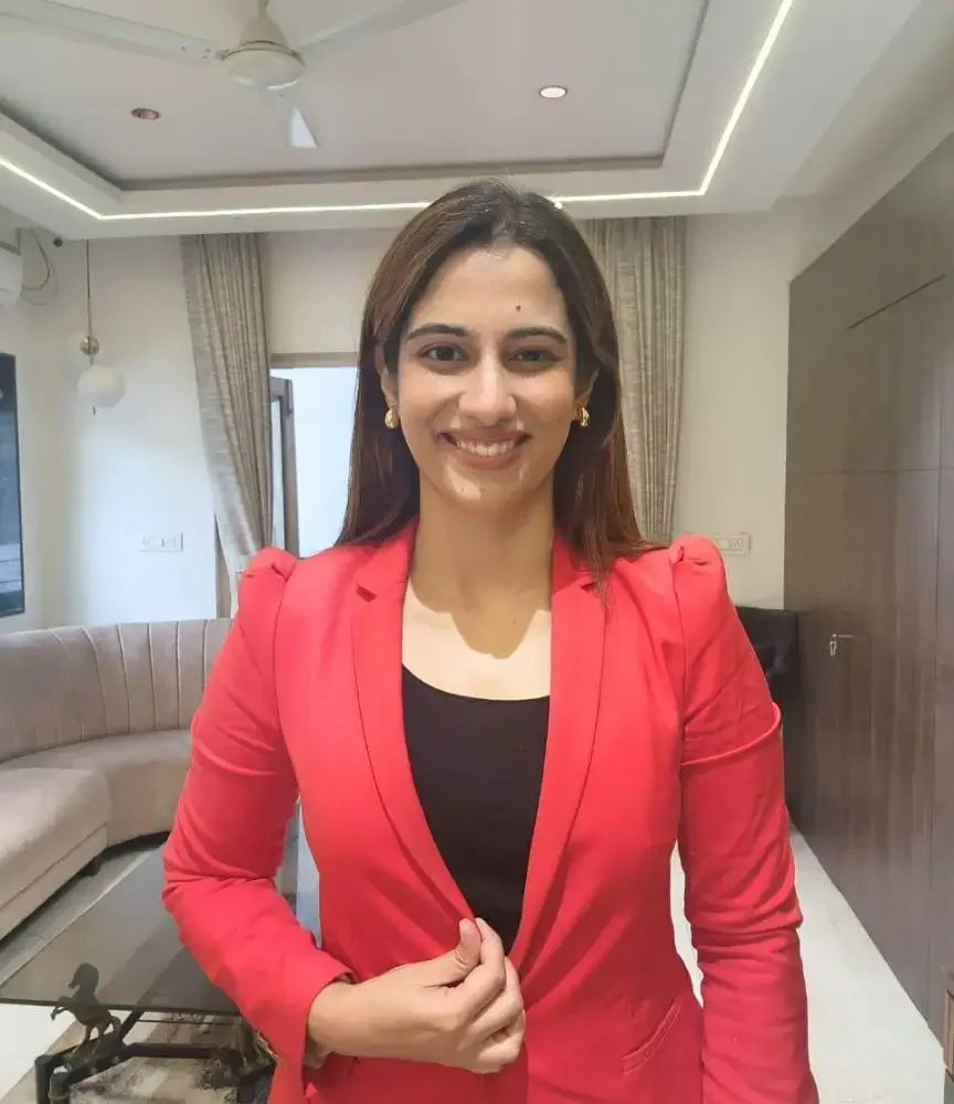 Dr. Apoorva Makan wearing red blazer.