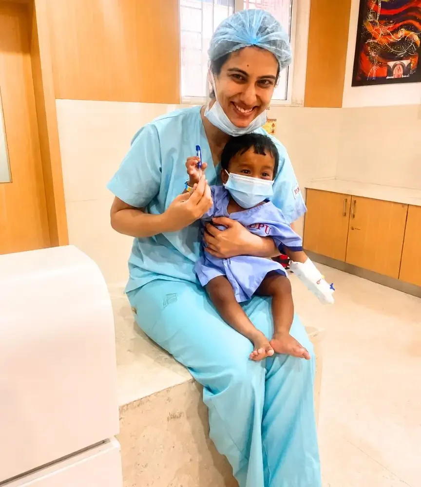 Dr apoorva Makan along with surgically operated baby.