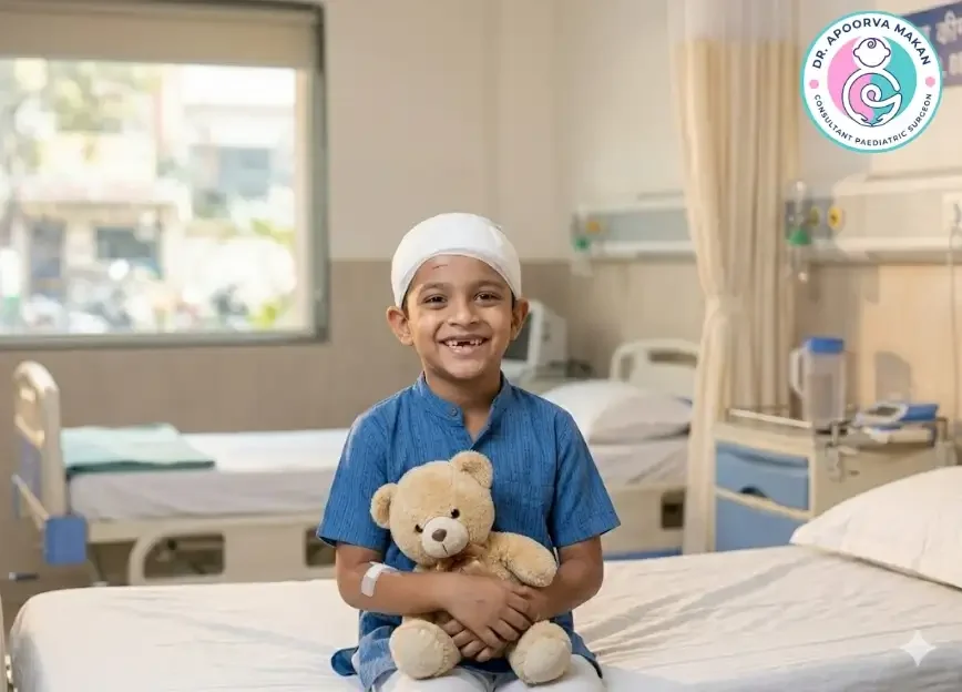 Smiling Indian kid with dressing on his head after a surgery.